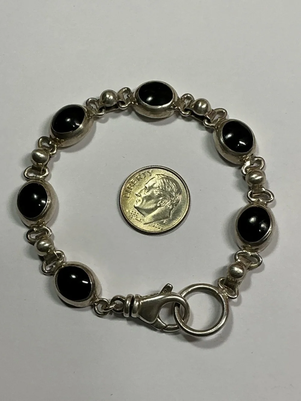 Sterling Silver Oval Shaped Black Onyx Link Bracelet. 7 inches long